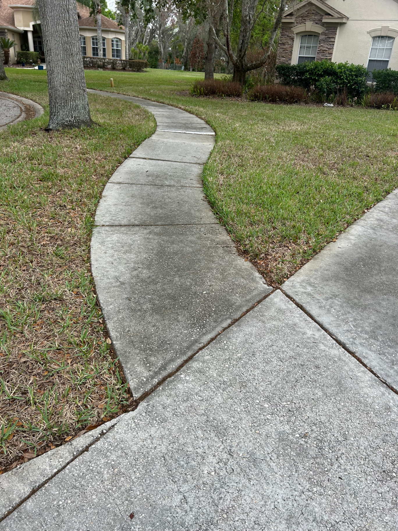 Dirty walkway with grime and stains before cleaning